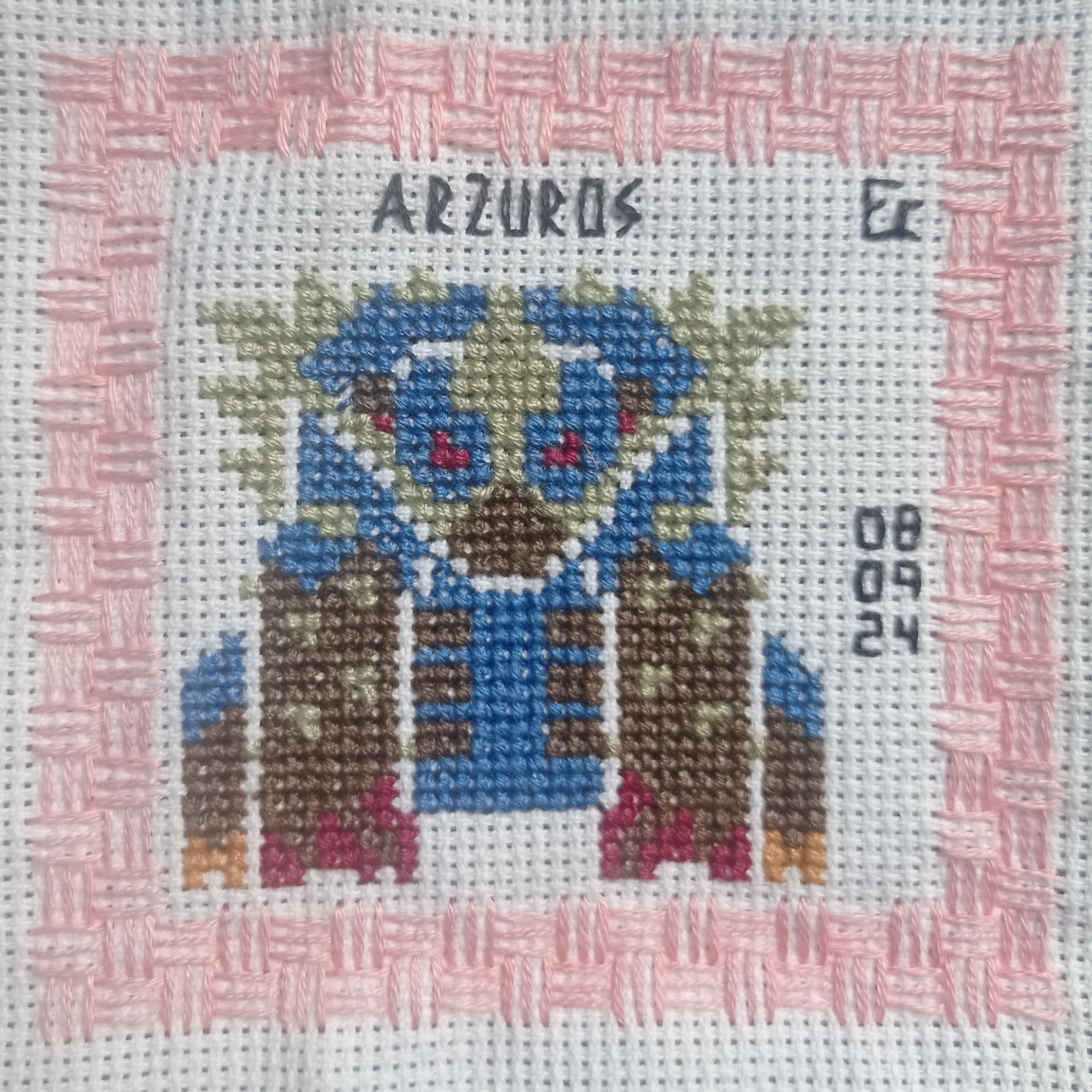 this is a close up of a crossstitch embroidery depicting the warcraft character az'uros, a creature from the game world of warcraft. it is a detailed piece of work featuring a colorful crossstitch pattern. the image is framed by a pink border of stitches. the words "az'uros" and "08.09.24" are stitched in the top and bottom right corners of the image.