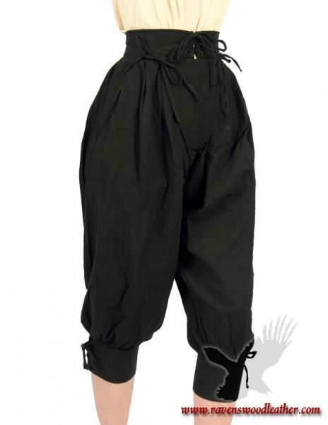 a closeup shot of a pair of black medievalstyle breeches worn by a model. the breeches are highwaisted with a drawstring waist and cuffed at the ankles. they are made of a dark, possibly linen or cotton fabric. the model is wearing a simple beige top. the image has a watermark at the bottom, indicating the brand ravenswoodleather. the overall style is reminiscent of clothing worn during the medieval or renaissance periods.