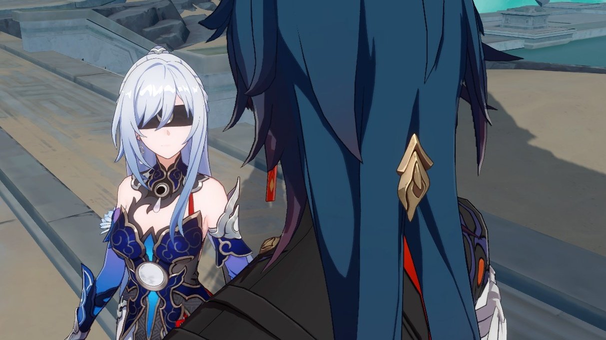 a still image from the game genshin impact. the scene features two characters.  the first character is a female, wearing a black and blue outfit with white hair and a blindfold. the second character is male and wearing a black and blue outfit with blue hair. they appear to be in a dialogue together in a game scene.