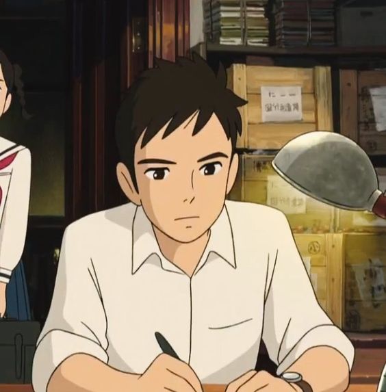 an anime depiction of a young man sitting at a desk and writing. he is wearing a white, shortsleeved, collared shirt and has a wristwatch on his left wrist. he has short, dark brown hair and dark eyes. the lighting suggests an indoor setting, likely during the day with warm lighting. the background shows shelves stacked with boxes and miscellaneous items.