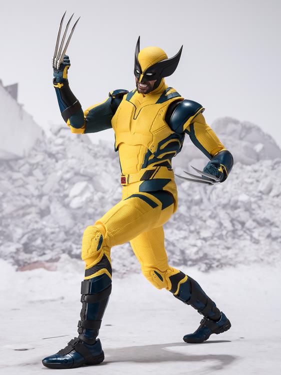 the image showcases a highly detailed action figure of wolverine from the xmen, set against a snowy and rocky backdrop. he is depicted in a dynamic pose, with his signature claws extended, highlighting his ferocity.  the figure's yellow and blue costume pops against the white background, and the studio lighting emphasizes the details and texture of the figure.