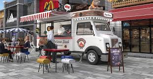 a white food truck parked on a city street. it has a red awning and a sign that says "hot dog shack." there are people sitting at tables outside the truck, enjoying their meals. the truck is parked in front of a storefront with a sign that says "cafe." there is a sign on the sidewalk with a menu.