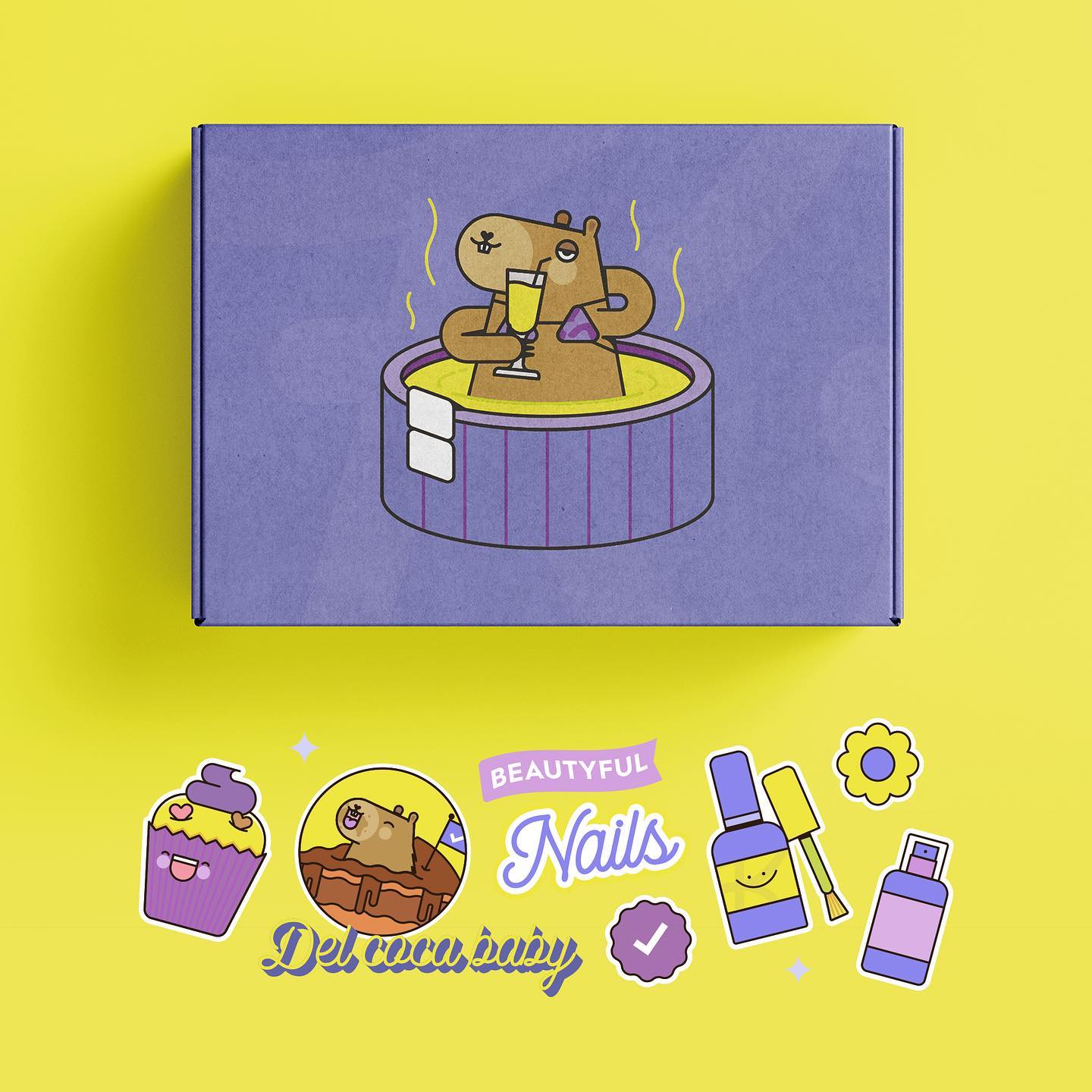 a purple box with a cute illustration of a capybara relaxing in a bathtub is set on a yellow surface. surrounding the box are stickers of cupcakes, capybaras, nail polish bottles, flowers, and the words "beautiful nails".