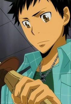 this is a closeup illustration of kise ryota, a character from the anime kuroko's basketball. he has brown hair with short spikes and brown eyes. he is wearing a light blue and white checkered shirt and a silver chain necklace with a black pendant. he is holding a basketball in his right hand, which is partially out of frame.  his expression is serious and focused. the background is dark and blurry.