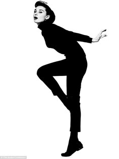 a black and white silhouette of audrey hepburn in a classic dress, posing with her leg raised, showcasing her elegance and style.