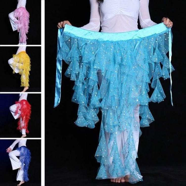 the image shows a person holding up a blue belly dance skirt with tassels, ruffles, and sequins. there are also smaller images of similar skirts in pink, yellow, red, and blue on the left. the person is wearing a white top and white pants.
