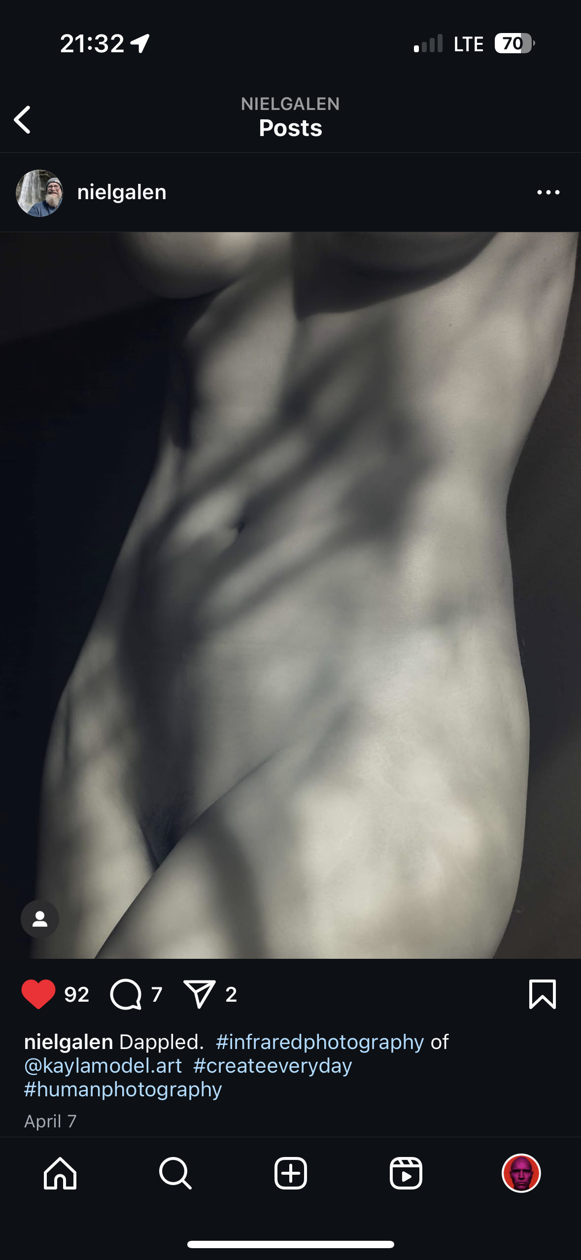 the image is an instagram post by the user "nielgalen."  it features a black and white, infrared photograph of a female torso and abdomen. the subject's body is partially obscured by dappled shadows, creating a dramatic and artistic effect.  the image is styled in a minimalistic, artistic manner.  the instagram caption includes hashtags indicating the photographic style, the model, and associated creative tags.  the post shows a number of likes, comments, and shares. the user's profile picture is also visible.