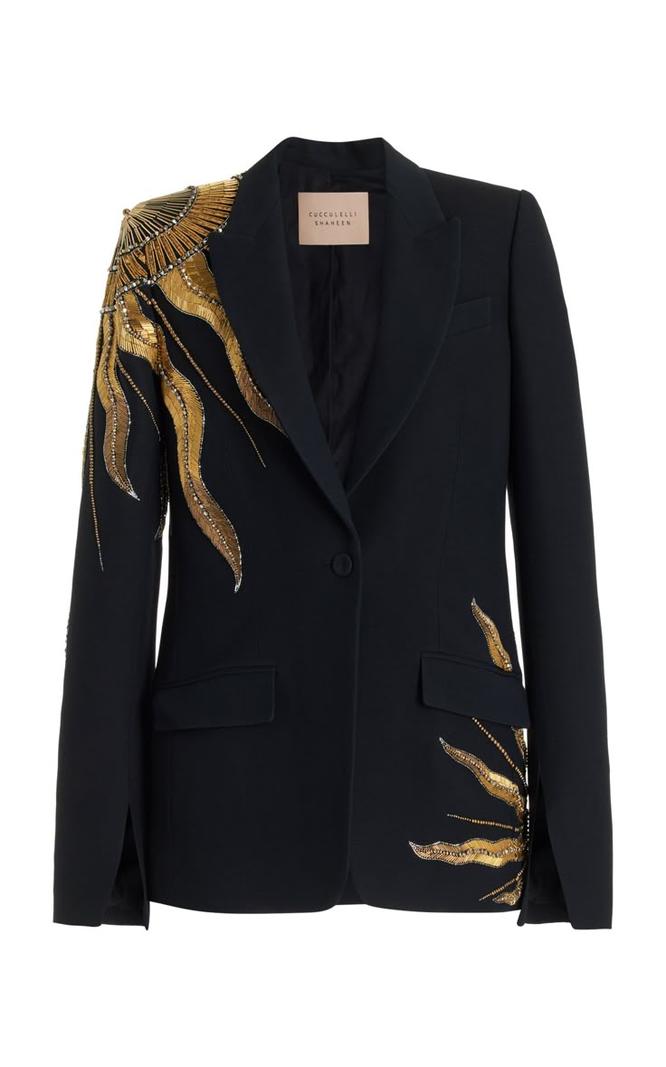 a black singlebreasted blazer adorned with gold embellishments on the shoulder and lower front. the jacket features a notched lapel, a single button closure, flap pockets, and slit cuffs.