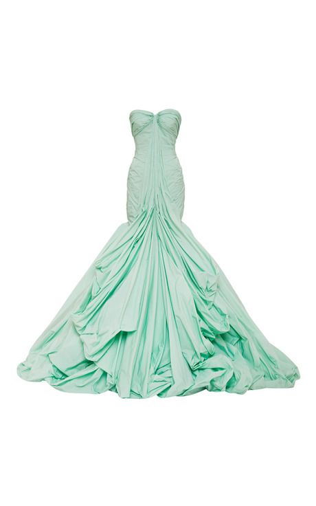 a strapless, light green gown is displayed against a white background. the draping fabric creates a voluminous skirt that cascades down, adding to the gown's dramatic effect.