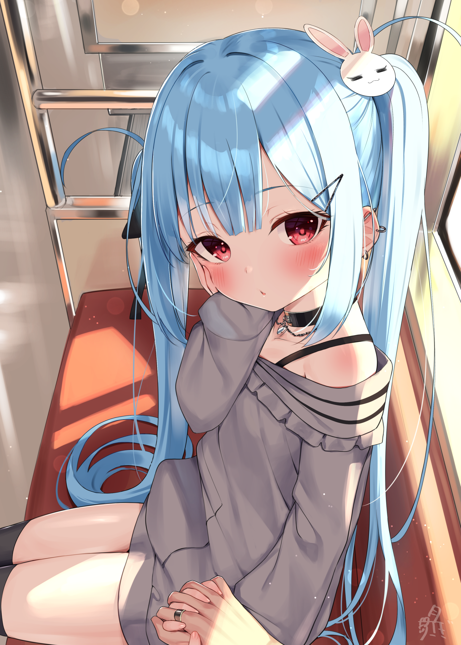 the image is a digital illustration of a cute anime girl with long, flowing blue hair styled in pigtails. she's wearing a grey offshoulder sweater and has a bunny ears hairpin.  her eyes are red, and she's blushing slightly. she's sitting in what appears to be a train or public transport, sunlight illuminating her from the side, casting shadows on the seat.  another hand is gently holding hers. the overall style is very kawaii and reminiscent of manga artwork.