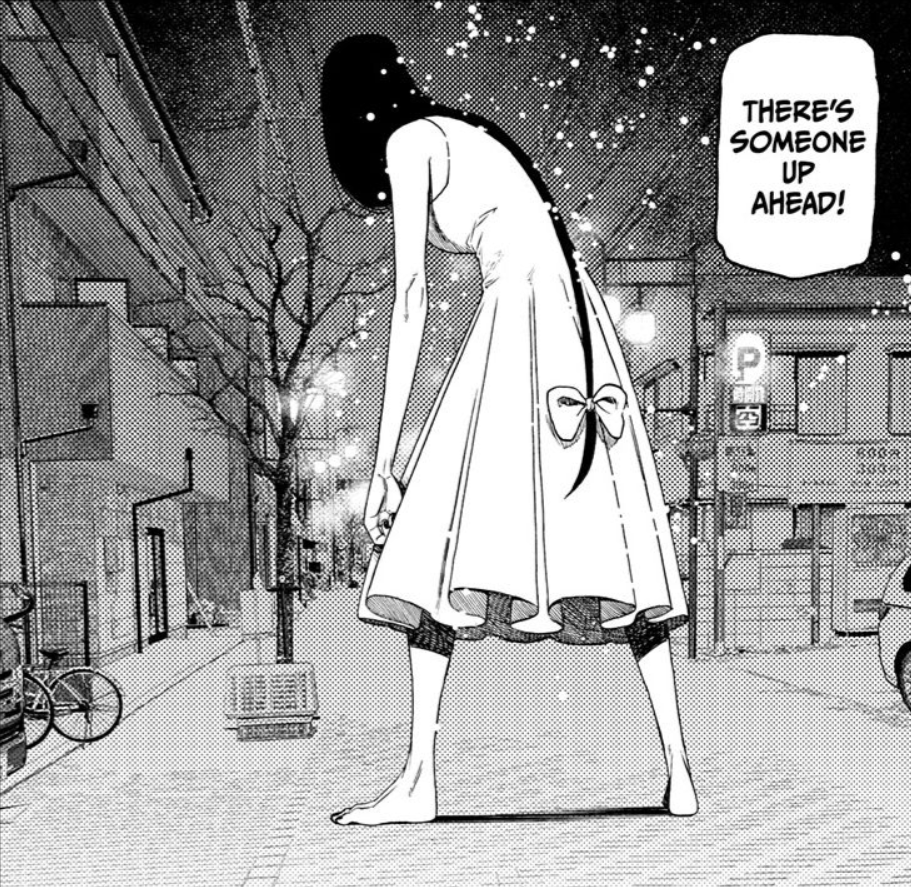 a black and white manga panel depicts a tall, slender woman in a white dress standing on a city street at night. her back is to the viewer, and she is hunched over slightly. her long black hair cascades down her back, reaching past her knees. the street is mostly empty, with a few buildings lining either side and a parked car in the distance. a speech bubble above the woman's head reads "there's someone up ahead!" the art style emphasizes the woman's height and creates a sense of mystery and unease.