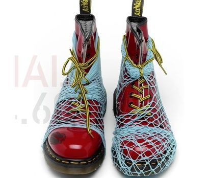 the image shows a pair of dr. martens 1460 boots that have been artistically modified.  the boots are a classic red color and have been completely wrapped in a light blue net, the yellow laces still visible. the net appears to be a type of fishnet or similar material. the boots are positioned slightly angled, and their modified appearance suggests a focus on fashion or art.