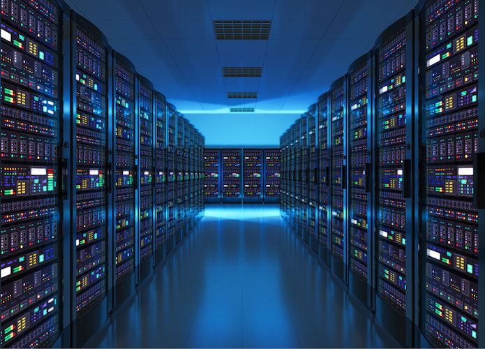 a long corridor in a server room, with rows of server racks on either side. the server racks are all lit up with colorful lights, and the room is lit with a cool blue light. the space looks clean, hightech, and somewhat futuristic, with an air of being intensely important and busy, but also calming and professional.