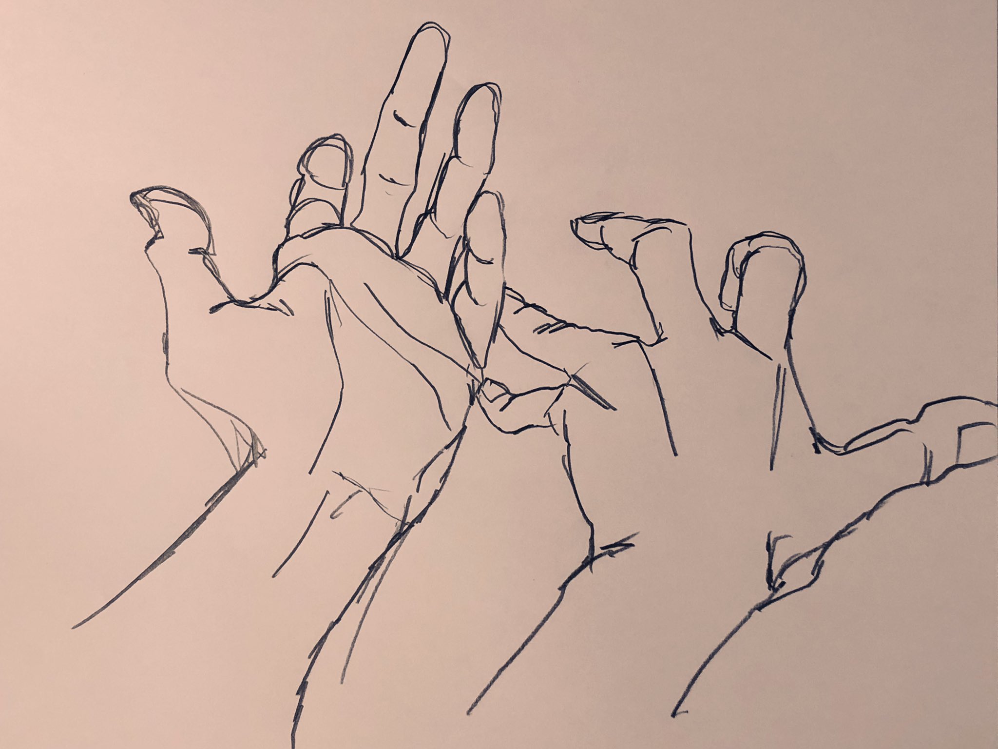 the image is a line drawing of two hands reaching towards each other. the drawing is done with black ink on tan paper. the hands are drawn in a slightly exaggerated style, with long, thin fingers. the image has a soft, dreamlike quality.