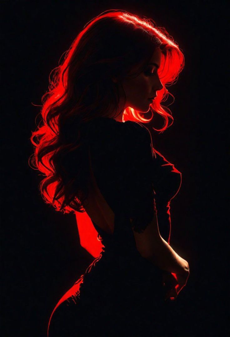 a woman with long red hair is silhouetted against a dark background. she is wearing a black dress and has a mysterious and seductive look on her face. the