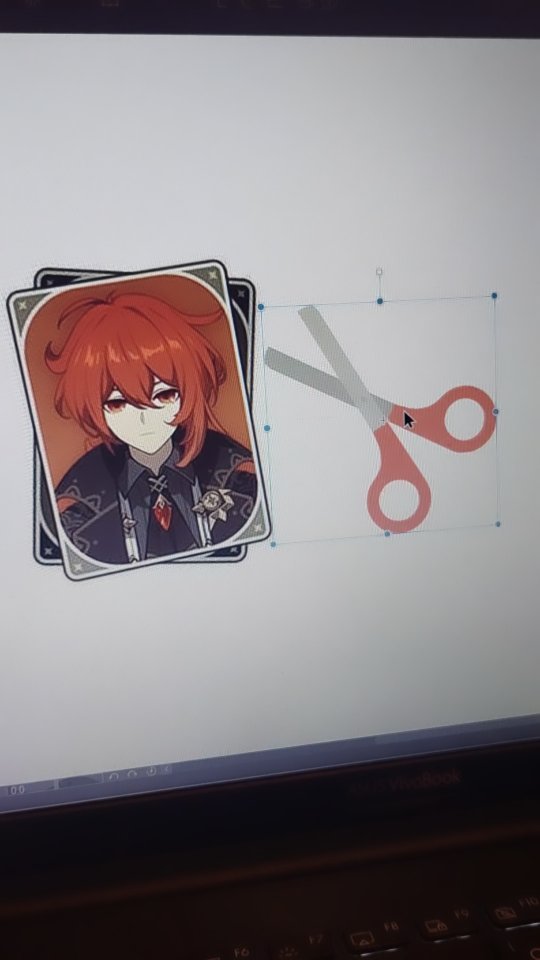 the image shows a computer screen displaying a digital image of thoma, a character from the video game genshin impact.  thoma's image is on a cardlike graphic.  a pair of scissors is overlaid on the screen, suggesting that the image is being edited or cropped. the overall impression is that someone is working on fan art or a digital creation related to the game.