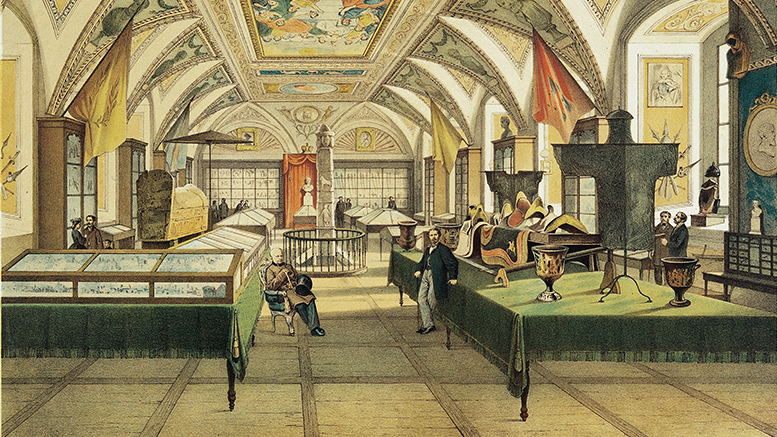 this image depicts the interior of a historical museum or exhibition hall. the scene is filled with visitors viewing various artifacts and displays. there are people standing and sitting throughout the hall, observing items displayed in glass cases, on tables draped with green cloths, and within enclosed areas. the museum is adorned with paintings, sculptures, decorative elements, and architectural features such as a vaulted ceiling with intricate designs. banners and tapestries hang from the walls, adding to the historical ambiance.