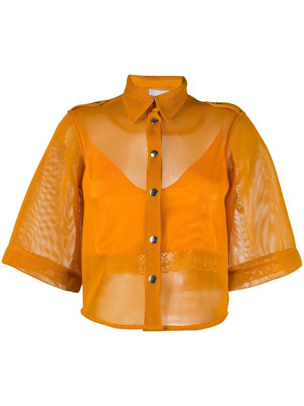 a short sleeve, orange, buttondown blouse with mesh material.
