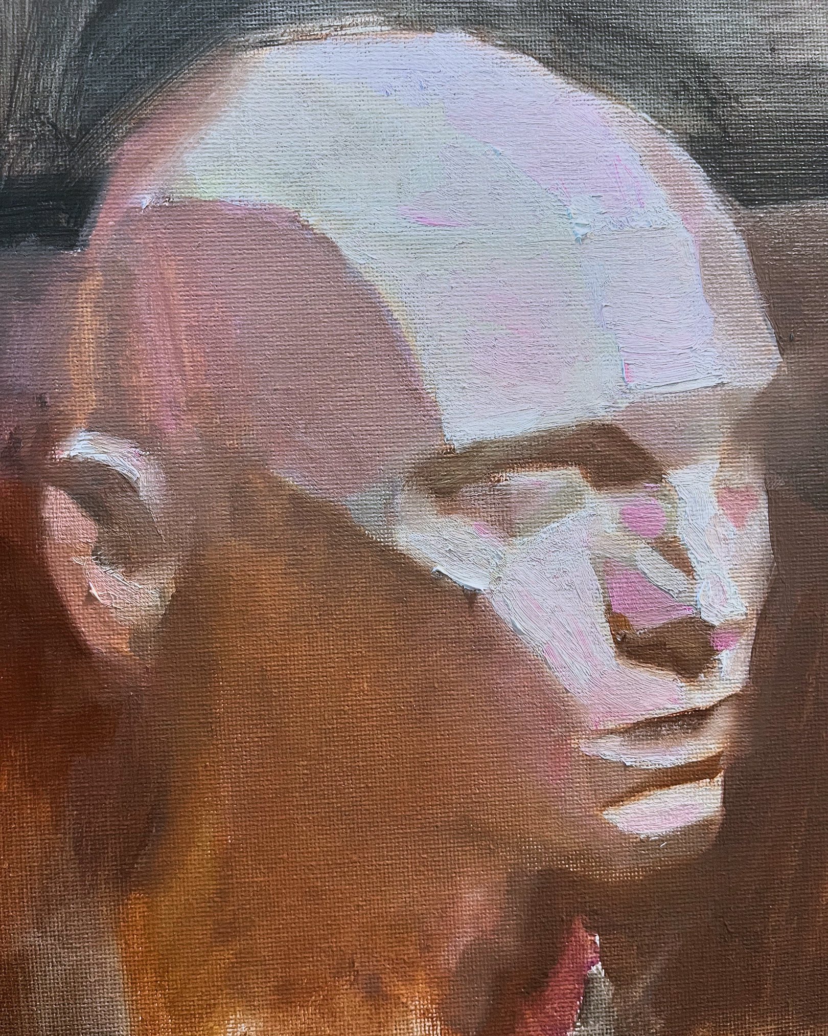 a closeup oil painting of a man's face. the painting is done in a realistic style and captures the man's expression in detail. the brushstrokes are visible and add to the texture of the painting. the man's face is turned slightly to the side, and he is looking off to the left. the light source is coming from the right, which creates a shadow on the left side of his face. the painting is done on a textured canvas, which adds to the overall effect. the colors are muted and earthy, which gives the painting a sense of depth and realism. the painting is a powerful and moving portrait of a man.