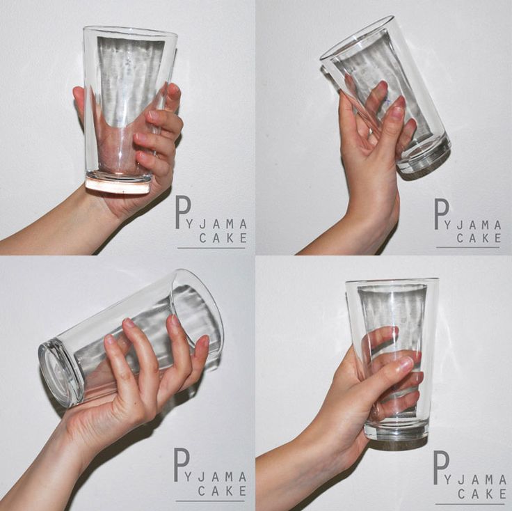 the image shows four different ways to hold a glass. the glass is clear and empty, with a slight curve on the side. the hand is holding the glass at different angles and positions.  the background is a white wall with a logo in the corner. the word "pyjama" in the logo is a reference to the brand name of the product.