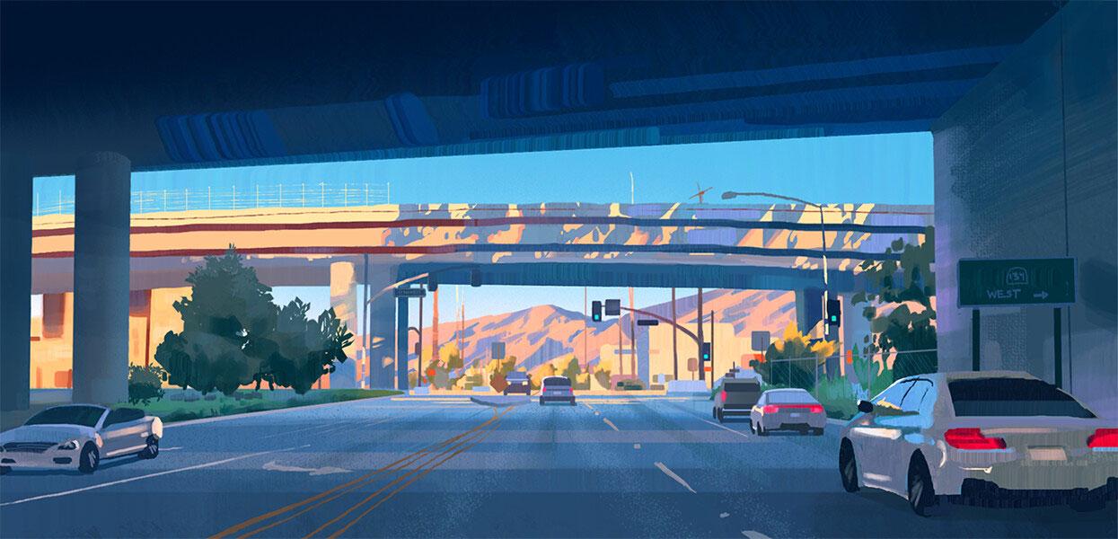 a cityscape scene of cars driving on a highway under a bridge. the image is taken from underneath the bridge looking out at the cars and the city beyond. the setting sun is casting long shadows across the scene.