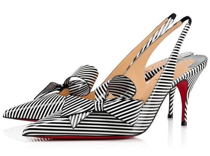 two black and white striped christian louboutin slingback high heels with bows are displayed against a white background. the red soles are visible.