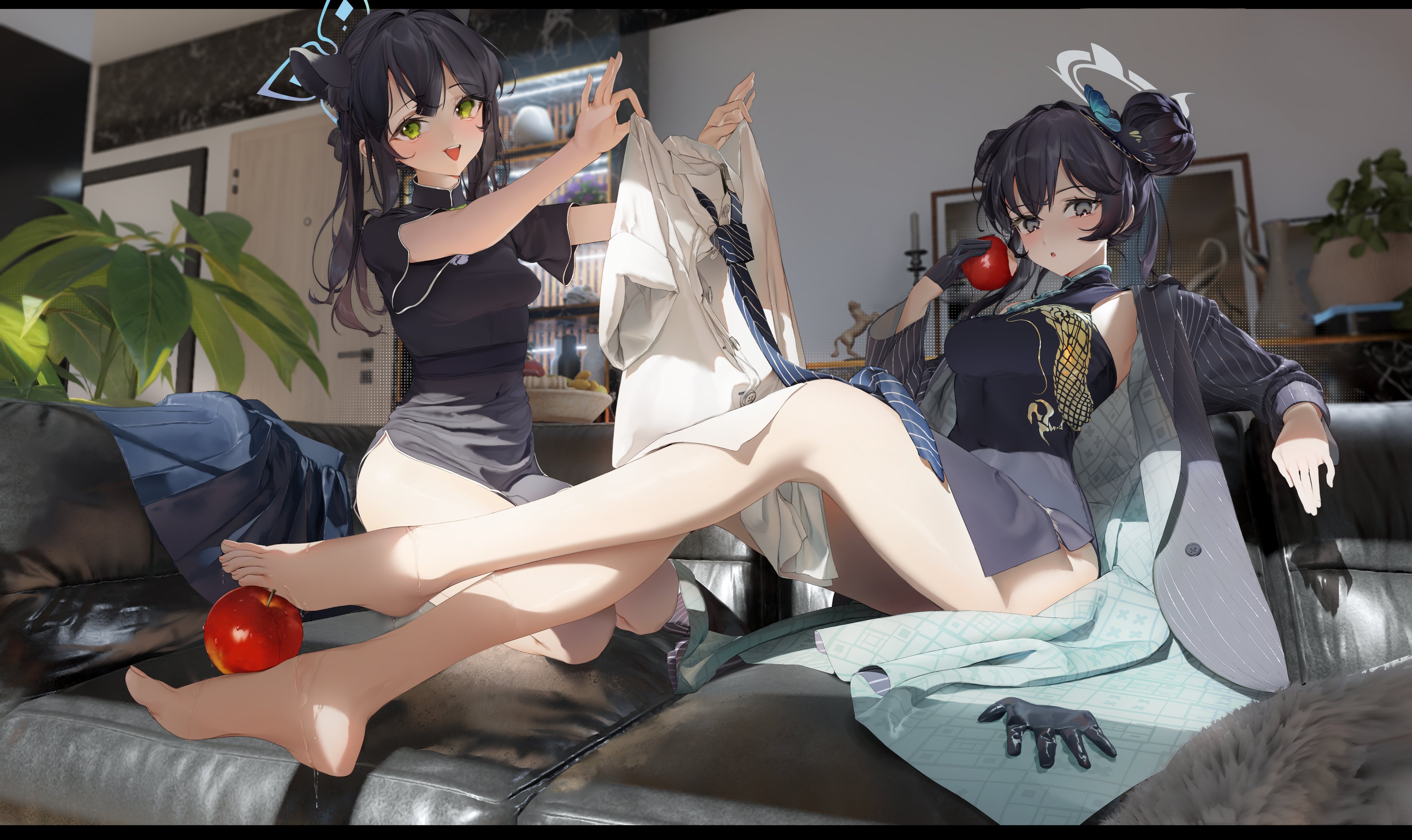 two anime style girls sitting on a couch with one holding a white shirt and a tie and the other holding an apple.