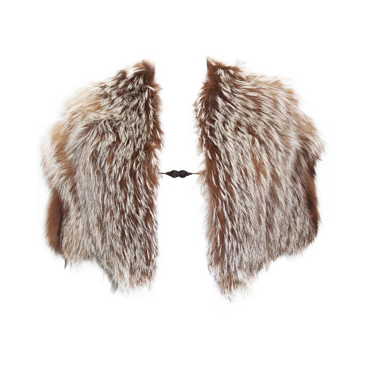 a brown and white fur stole, likely made of fox fur, is shown on a white background. the stole is laid out flat, showing both sides of the fur. the fur is soft and fluffy, with a mix of brown and white hairs. the stole is attached with a black strap in the center.