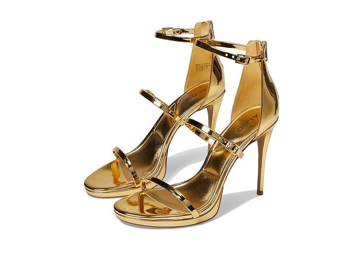 a pair of gold high heeled sandals with straps. the sandals are made of a metallic gold material and have a stiletto heel. the shoes are designed with a double strap across the foot and an ankle strap. the shoes are from the brand aldo.