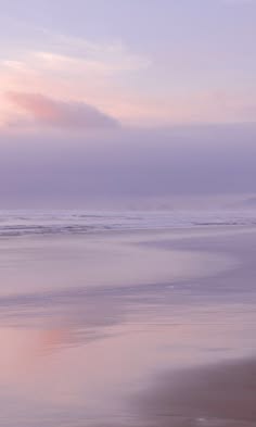 a serene seascape with a pastel pink and purple sunset sky over a calm ocean. the water is gently rippling, creating a sense of peace and tranquility. the soft, ethereal light illuminates the scene, casting a dreamy glow over everything. the horizon line is blurred, adding to the dreamy atmosphere. the overall impression is one of beauty and tranquility.