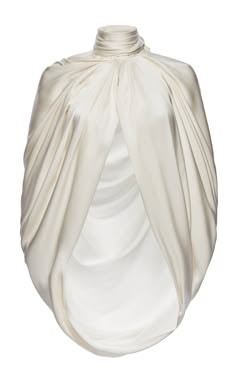 an abstract sculpture made of white fabric. the fabric drapes elegantly and is smooth and soft, creating an elegant and flowing form. the sculpture is minimalist and contemporary, with a focus on the material and the shape.