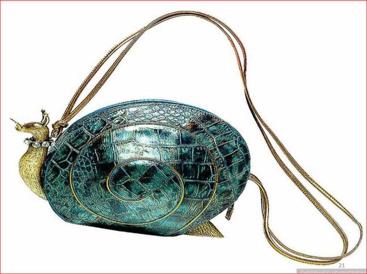 a detailed image of a snailshaped purse. the purse is colored in various shades of green and has a shiny texture mimicking crocodile skin. the head and tail of the snail are gold and are attached to the main body of the purse. the purse has a long, gold strap attached to either side of the snail. the purse sits in front of a white background.