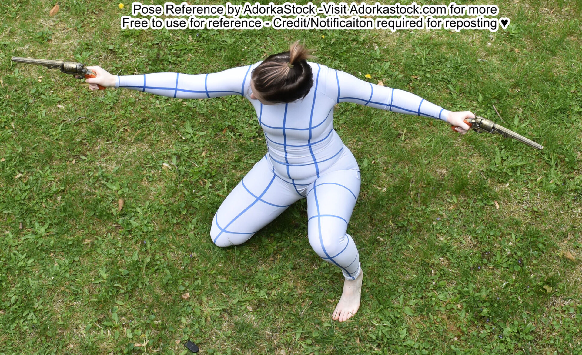 a woman in a white and blue grid patterned bodysuit is kneeling on grass with her arms extended to the side. she is holding a revolver in each hand and is looking off to the side.