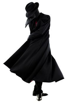 a man dressed as a plague doctor stands against a white background. he is wearing a long black coat, a black hat with a beak mask, and black shoes. the outfit is complete with a black beak mask and a red scarf around the neck. he stands with his feet together and his arms at his sides. the image is both spooky and mysterious, and evokes a sense of history and the past.