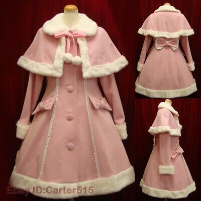this image showcases a charming pink lolita fashion coat. the coat features a distinctive cape design adorned with white faux fur trim, creating a sweet and elegant look. the coat is displayed on a mannequin against a rich red backdrop, highlighting its delicate pink hue. the three perspectives – front, back, and side – provide a comprehensive view of the coat's unique design elements, including the delicate bow detail on the back and the flattering aline silhouette.