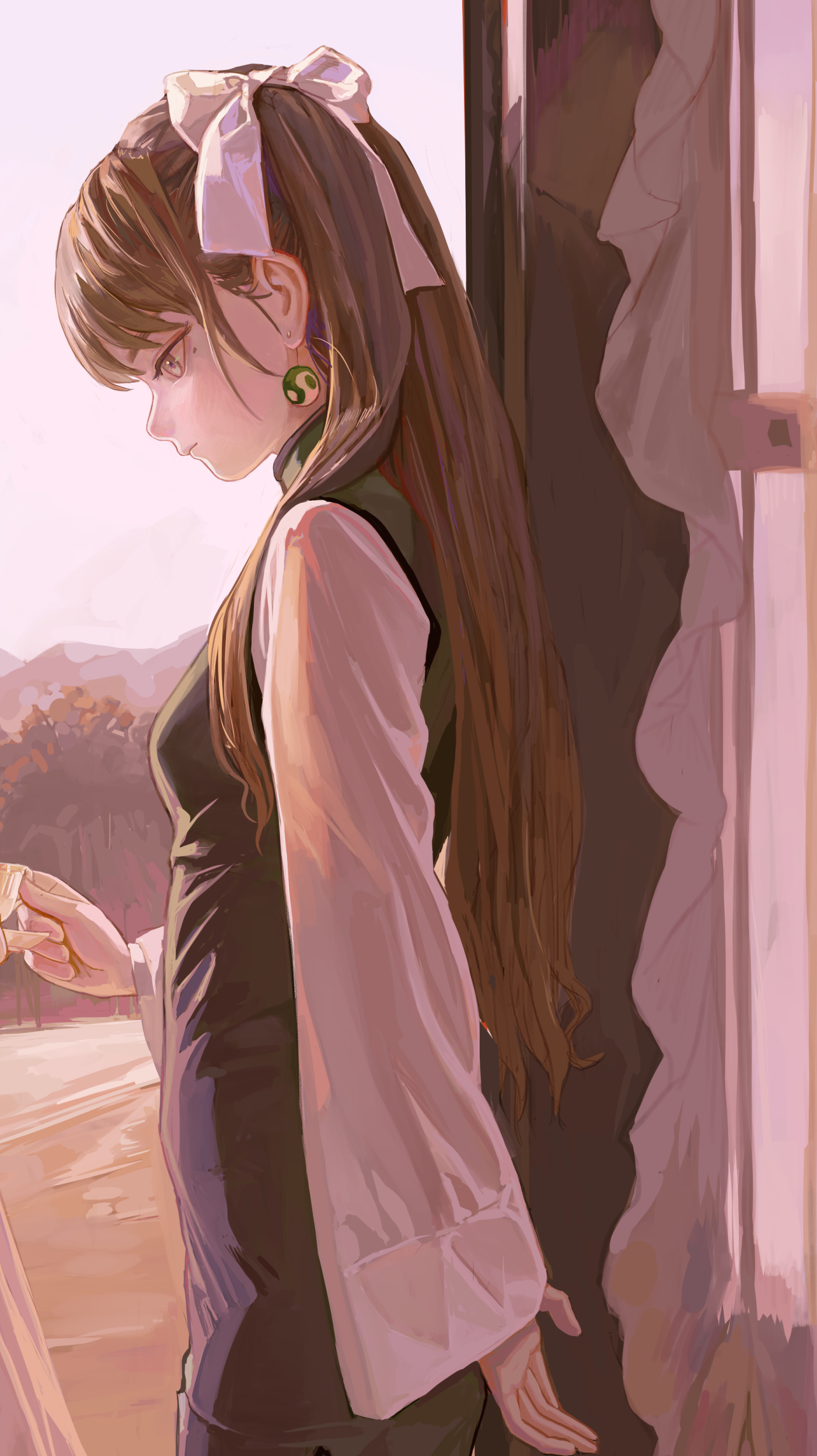 a digitally illustrated portrait of a slender anime girl with long brown hair, her head adorned with a large white bow, and a single green circular earring on her left ear. she is standing indoors, dressed in a dark green dress with long, loose white sleeves. she is looking downwards to her left, holding an object in her left hand. a landscape featuring mountains and trees is visible through a window behind her. to her right, a curtain hangs beside a window frame. the color scheme is predominantly pink and brown.