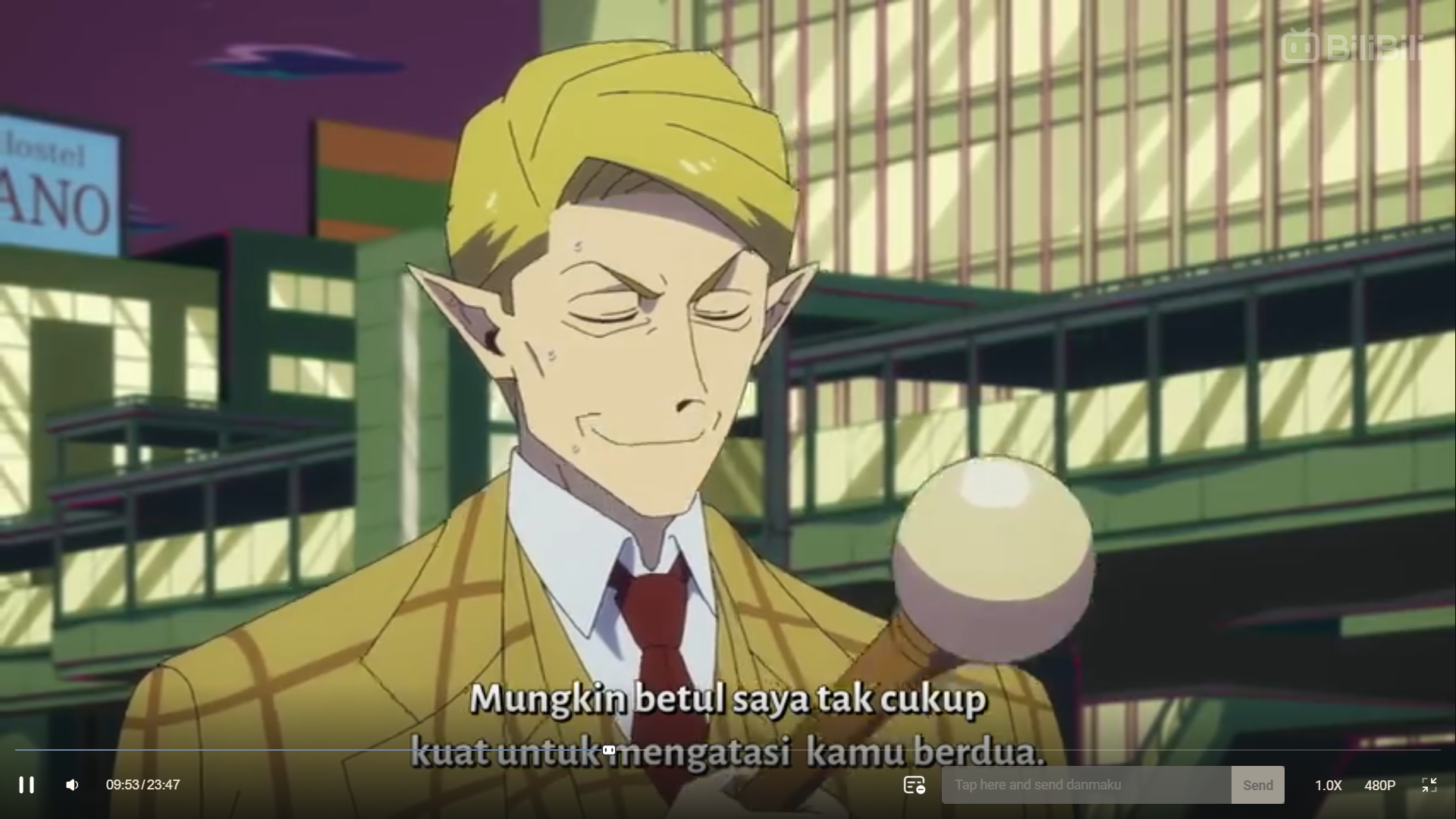 a screenshot from an anime featuring a man with blonde hair and pointy ears, suggesting he's a vampire. he's wearing a yellow suit and a confident, almost smug, expression. he's holding a white sphere on top of a cane. the background shows a city street with buildings in the background. the subtitles at the bottom of the image translate to "maybe i'm not strong enough to handle you two." indicating a tense or confrontational scene.