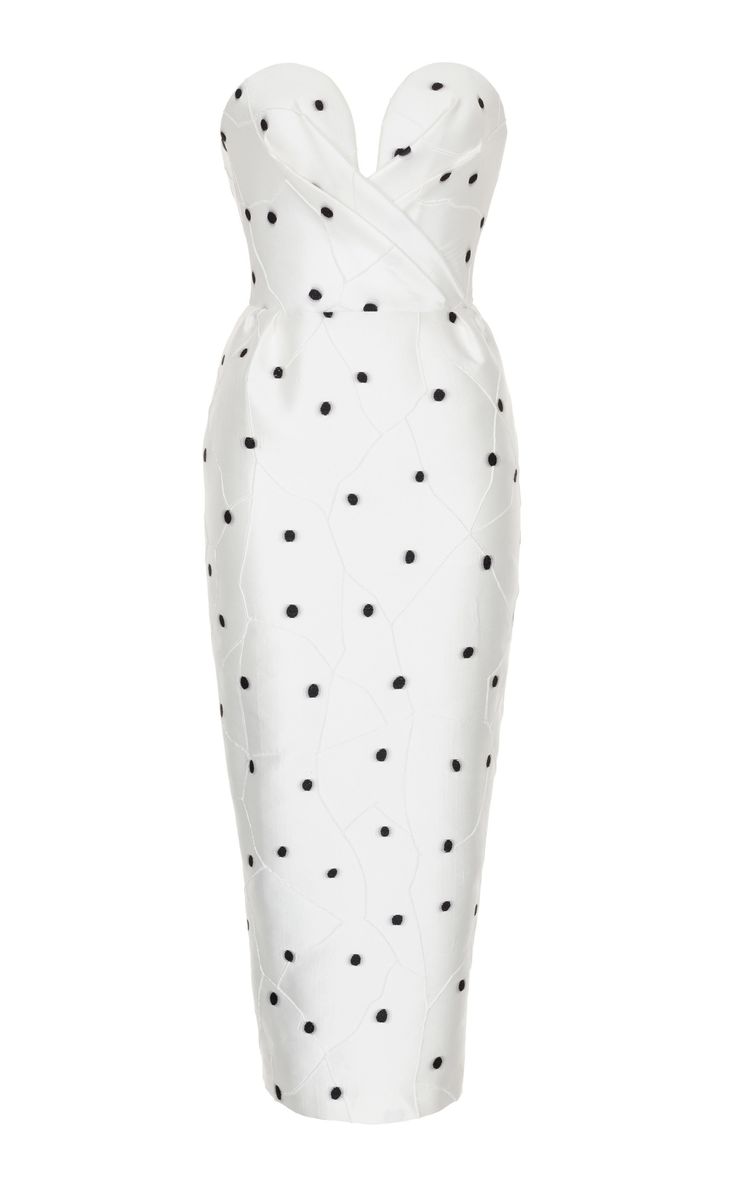 a white strapless polka dot dress with a fitted silhouette. it is a beautiful and elegant dress perfect for a special occasion. the dress has a sweetheart neckline and a fitted bodice. the skirt is full length and flows beautifully. the dress is made of a highquality fabric and is very well made.