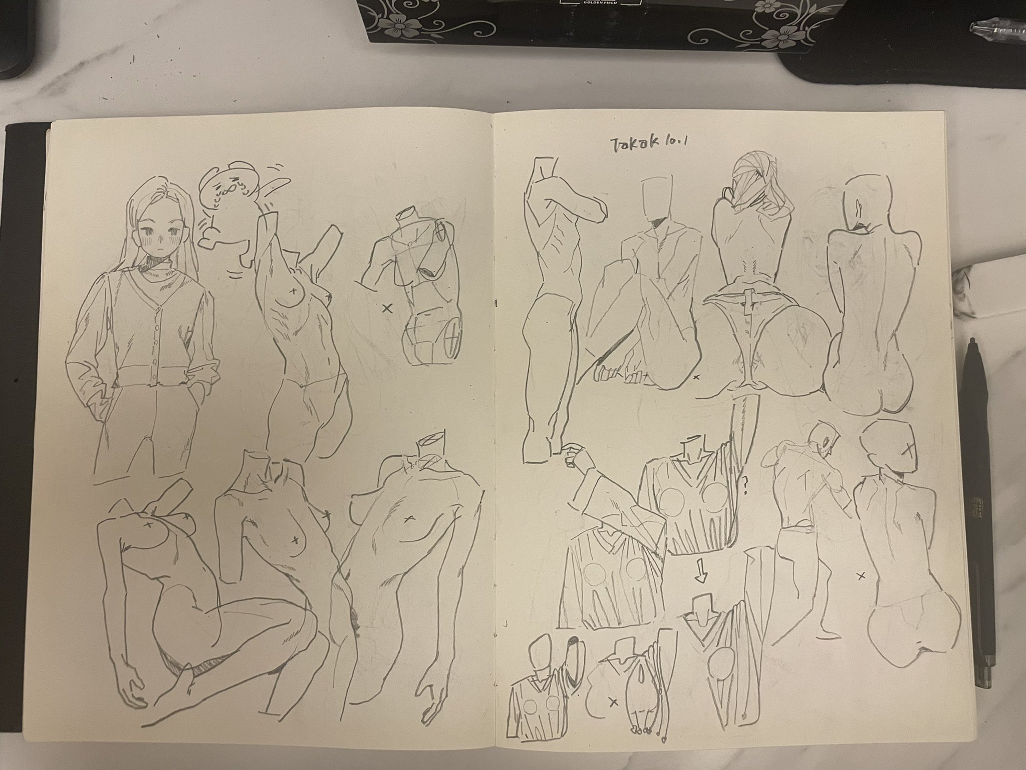 the image is a sketchbook spread filled with pencil drawings and sketches. the left page features several sketches of female torsos and fullbody figures, both clothed and nude. there is also a cartoon character included. the right page continues with similar figure studies, focusing on the human anatomy in various poses. the sketchbook contains artistic studies, likely for practice or exploration of form and anatomy. there is a title, "takak lo.1" written on the top.