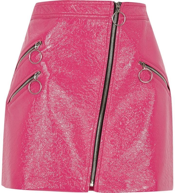 a bright pink, highshine, leather or fauxleather mini skirt is pictured. it has multiple decorative zippers with ring pulls, and a fulllength asymmetrical zipper closure that runs from the waist to the hem of the skirt.