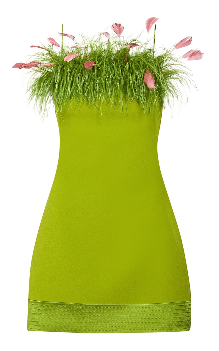 a vibrant green strapless mini dress adorned with a feather trim is showcased against a white background. the dress features a straight, fitted silhouette with a decorative band at the hemline, complementing the lively green fabric. crowning the dress is an elaborate feather trim, incorporating both green grasslike feathers and delicate pink florallike feathers, adding a whimsical touch to the garment.