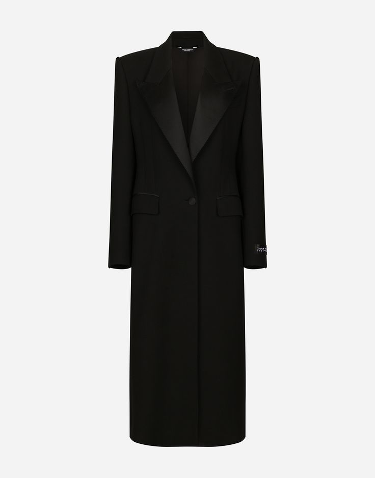 a black long coat for women with satin collar and lapels.  it has a singlebreasted button closure, long sleeves, and a slim tailored fit. the coat is elegant and stylish, perfect for formal occasions.