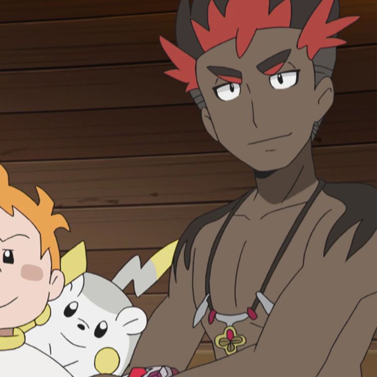 a male anime character with red hair and dark skin is sitting on a wooden floor. he is smiling and looking at the camera. he has a necklace with tribal designs around his neck. he has a muscular build and is wearing a simple outfit.  he has his arm on the shoulder of a person with blonde hair.  the blonde person is holding a toy that looks like a pikachu.