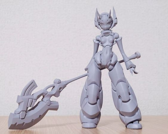 a grey, unpainted model of a female robot with a staff. the robot has a slender build with exaggerated limbs and a sleek, futuristic design. the staff is large and ornate, suggesting a fantasy or scifi setting. the model appears to be made of plastic or resin and is likely a kit or 3d print. it stands on a wooden surface against a plain white background.