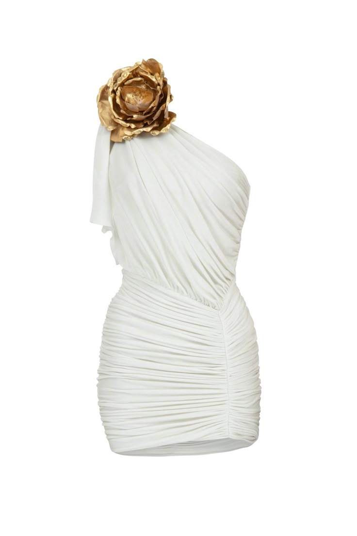 a short, oneshoulder white dress with ruching detail and a large gold flower embellishment. the dress is draped and ruched, creating a textured and formfitting silhouette.