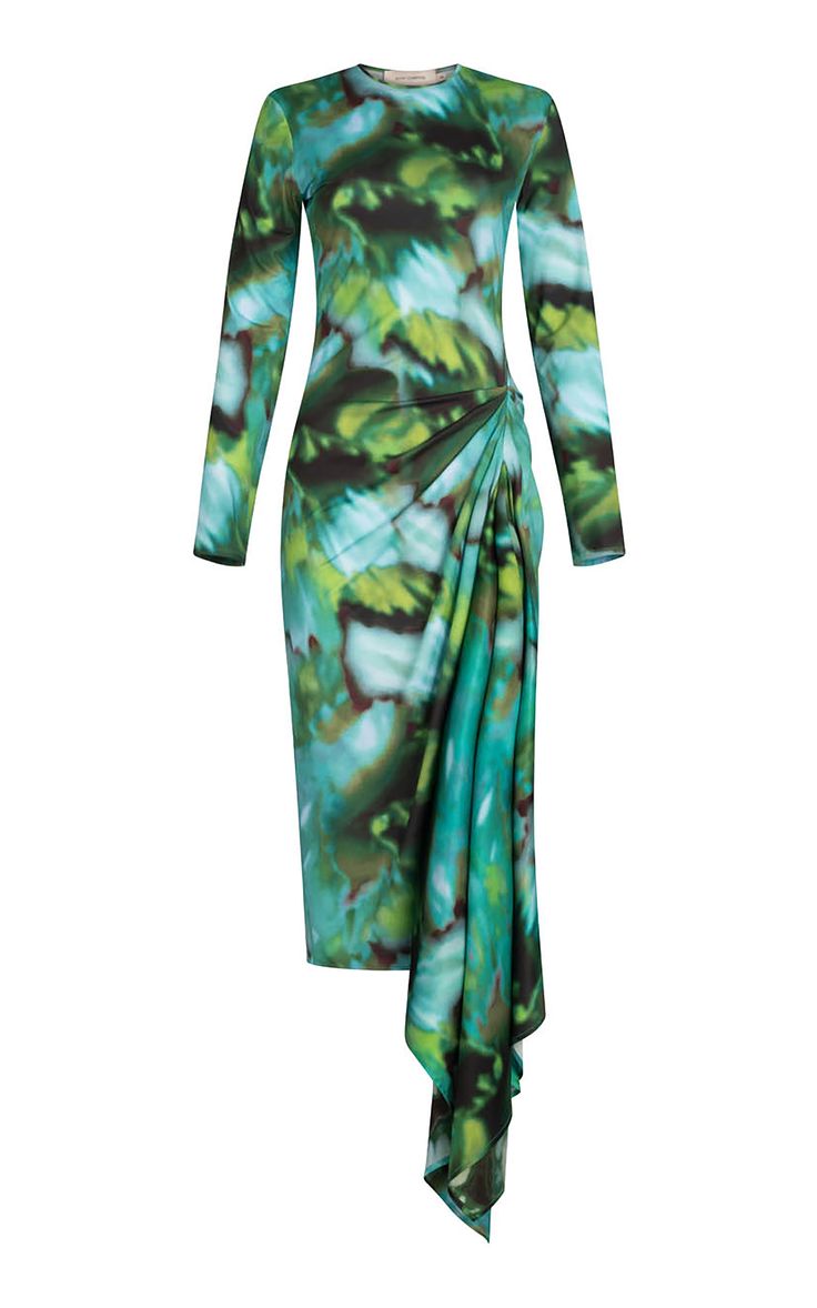 a model wears a longsleeved dress with an abstract tiedye print in shades of green and blue. the dress is flowy and elegant, with a tiedye pattern and a wrapstyle design. the dress is styled for a formal occasion. the dress is a perfect choice for a party or a special occasion.