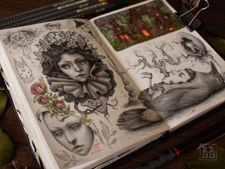the image shows an open sketchbook filled with intricate pencil drawings. the left page features a captivating portrait of a woman with a crown of flowers and butterflies, surrounded by other smaller sketches of flowers, faces, and a rabbit. the right page presents a more somber scene with a man lying beneath a gnarled tree, his face turned towards a crow perched on a branch. a small, colored sticker of a whimsical house is pasted onto the top right corner. the overall aesthetic of the sketchbook is dark, whimsical, and evocative, with a focus on nature and fantastical elements. the drawings are rendered in graphite with skillful use of shading and detail, creating a sense of depth and texture. the soft, diffused lighting further enhances the ethereal and slightly haunting atmosphere of the artwork.