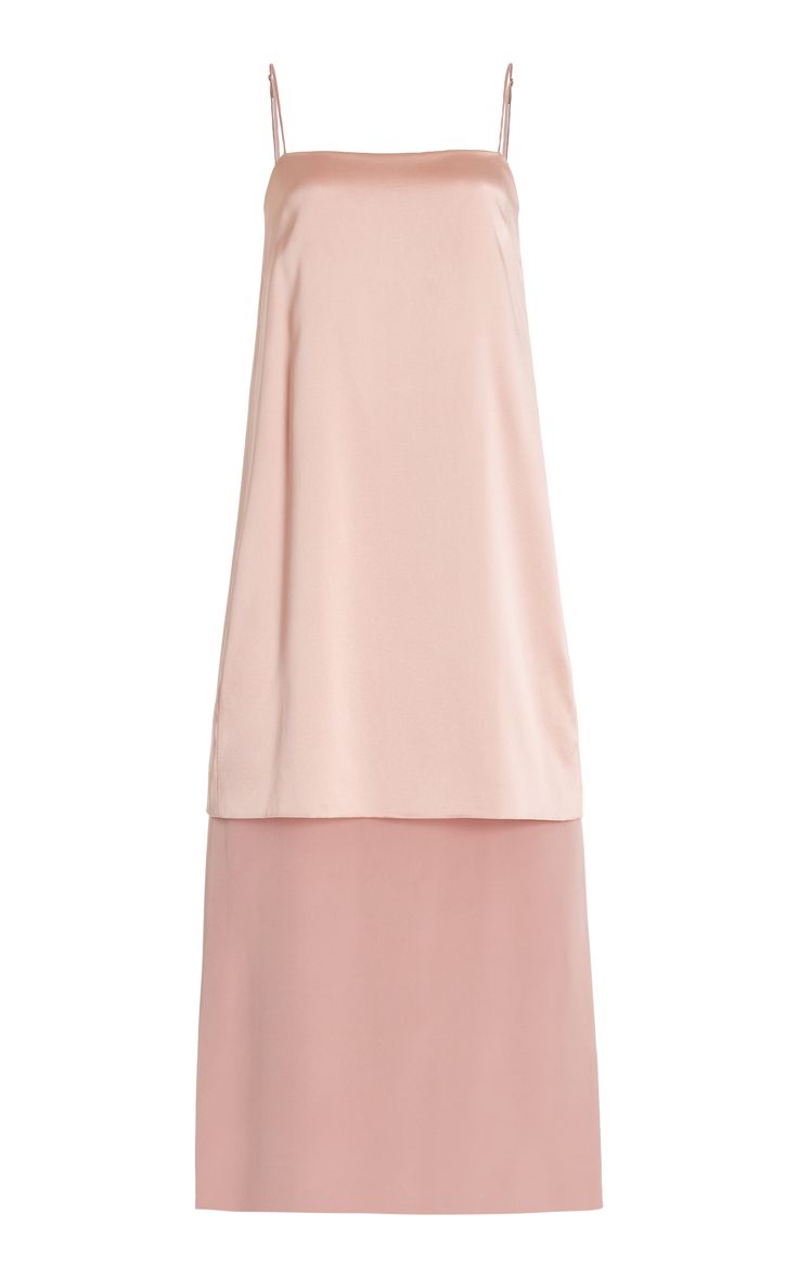 a pink sleeveless satin midi dress with a simple and elegant design. the dress is perfect for a summer evening event.