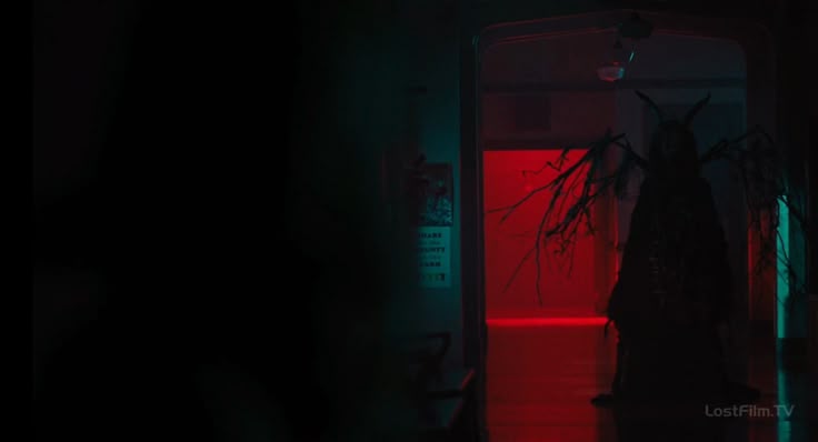 a dark, ominous image showing a silhouetted creature with horns and branches in a doorway illuminated by red and blue lights. the scene is scary and creepy, evoking a sense of horror.