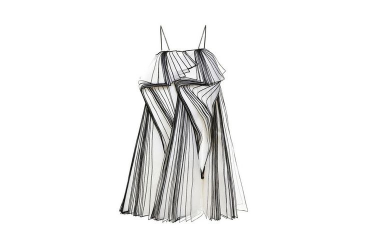 a white, sheer dress with black stripes and ruched detailing. the dress is sleeveless and has a high neckline. the ruched detailing is concentrated around the bust and shoulders, creating a dramatic and elegant look. the dress is fitted through the body and flows out in a full skirt. this is a highfashion dress that would be perfect for a special occasion.
